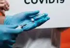 Person Holding Syringe